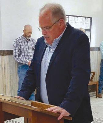 PASTOR WILLIE ISAACSON reads scripture honoring the national day of prayer. DAVID DONALDSON | Staff