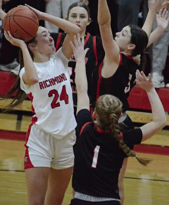 BRYLEE CASTILLEJA (left) attempts a contested shot during the Spartans’ meeting with Odessa in the girls title game at the Richmond Winter Classic. SHAWN RONEY | Staff