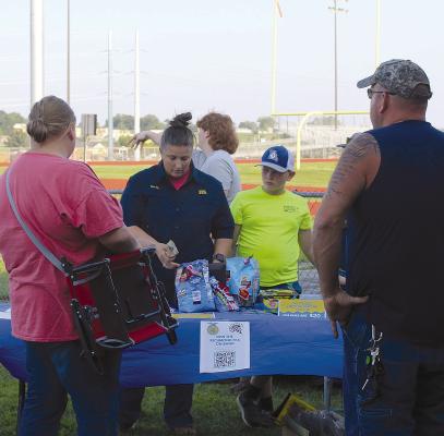 RICHMOND AGRICULTURAL educator Laura Allen details the benefits of the Ag program to parents at the Back-to-School Bash.