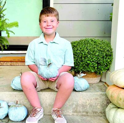 GRAYSON GROSSO, 9, shows off a teal pumpkin and the new message for candy-filled holidays. His mother, Sara Grosso, is an advocate for the project. SARA GROSSO | Submitted