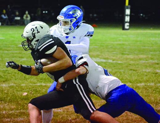 GAGE SMITH, sporting No. 21 on his helmet but a No. 10 jersey, fights for yards during the first half of Norborne Hardin-Central’s District 4 Tournament meeting with the Southwest co-op Nov. 3 at Hardin-Central. SHAWN RONEY | Staff