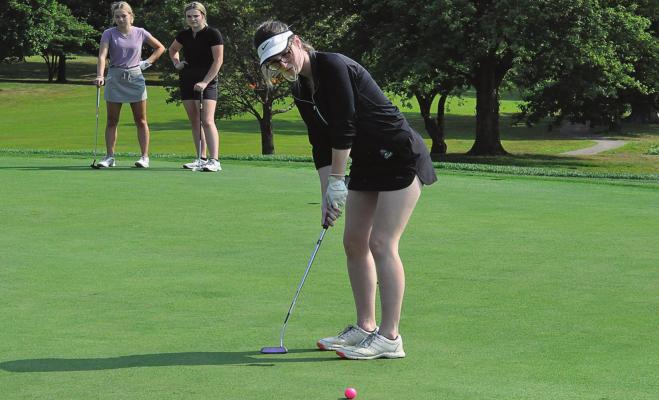 RICHMOND SENIOR attempts a short putt Monday at Shirkey Golf Club during the first day of fall sports practices. SHAWN RONEY | Staff