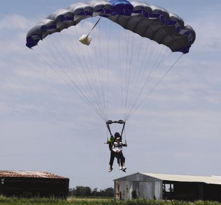 MARK JOHNSON with his instructor coming in for a landing at Noah’s Ark Airport in Kansas City. SHARON DONAT | Staff