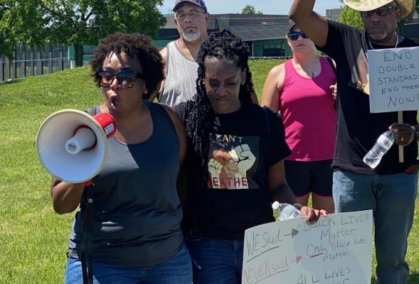 KATINA GILL appeals for an end to divisions caused by race. BRIAN RICE | Staff