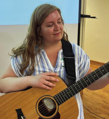 Ray County Special Needs Service Music Therapist Sydney Winders tunes her guitar before starting the first CAP Community Choir 16-week event. SOPHIA BALES | Staff