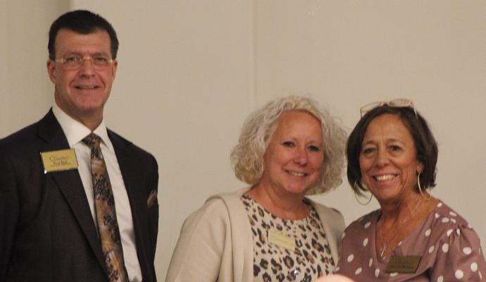 BECKY FRANKLIN (center), Shirkey Hospice “What If” program coordinator, accepts the award for Outstanding Service from Outgoing Chamber President Troy Rust (left) and Incoming Chamber President Christal Milligan. SHARON DONAT | Staff