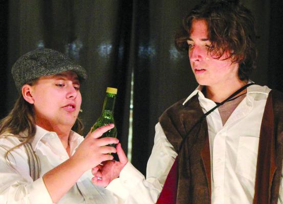 AVERY OGLE (left) as the Mantu Newsie and Ashton Estep as Romeo rehearse a scene during the school play. SHARON DONAT | Staff