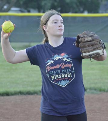 LILLY LYON rears back to throw home from third base.
