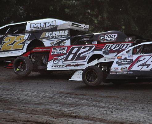 DRIVING THE 82 car, Richmond’s David Wood leans into a turn during his heat race June 12 at Central Missouri Speedway. SHAWN RONEY | Staff