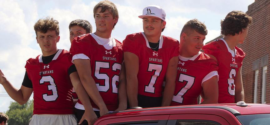 JOINING IN HOMECOMING PARADE activities are Richmond football players Jayden Pearson (from left), Mattox McCloud, Luke Gifford, Jack Green, Carson Seek and Nathan Nichols. SHARON DONAT | Staff