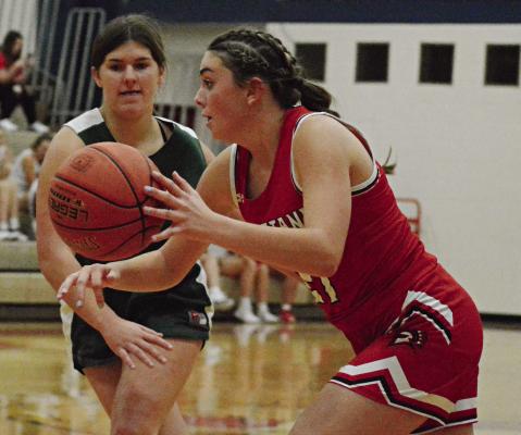 SOPHOMORE EMMA HASH dribbles left during Richmond’s Nov. 14 preseason jamboree scrimmage with Polo, hosted by Lawson, in the Lawson High School gym. SHAWN RONEY | Staff