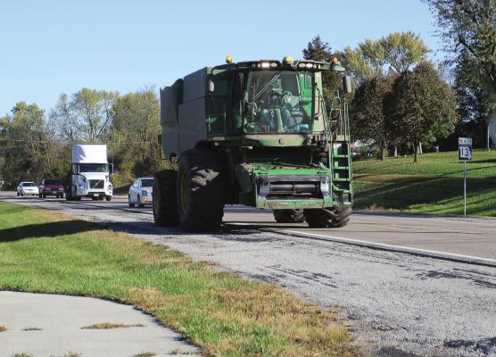 MUCH OF THE HARVEST is in, but work remains. Grain must be hauled along roads throughout the area. Along Highway 13, vehicles move slowly in a line behind farm equipment. The Missouri Coalition for Roadway Safety reminds drivers to be aware of slow-moving combines and other farm equipment. J.C. VENTIMIGLIA | Staff