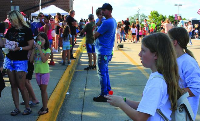 Bella Seak plays darts at one of the booths during last year’s Back-to-School Bash at Richmond High School. SOPHIA BALES | Staff