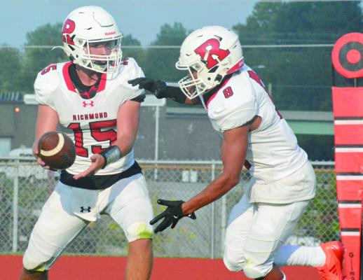 THE KEY for Richmond to win its season opener Friday against visiting Harrisonville is to stay focused, according to junior Cyrus Jackson (No. 8), shown taking a handoff Aug. 19 from Jacob Lieberknecht at Spartan Stadium. SHAWN RONEY | Staff