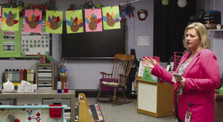 DEAR ELEMENTARY Principal Dr. Sarah Boyd shows off the childrens’ Thanksgiving artwork. SHARON DONAT | Staff