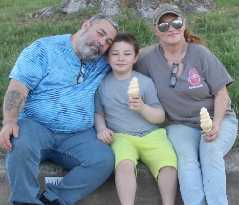 RANDY BOUDD (LEFT) WITH HIS son, Kash, and wife, Karry, take a break from the festivities to enjoy ice cream cones. MIRANDA JAMISON | Staff