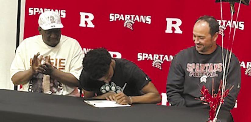 CHRISTOPHER WEBB II (center) signs with Northwest Missouri State University for sports medicine. Submitted