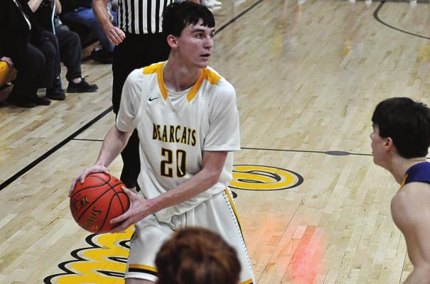 SENIOR ETHAN WILSON, one of two 1,000-point scorers on Orrick’s varsity boys basketball team this season, protects the ball as he looks to pass during the Bearcats’ 61-30 season-ending loss March 5 to Mound City/Craig in the Class 1 state quarterfinals. Wilson is among five graduating Bearcats. SHAWN RONEY | Staff