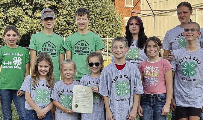 RICHMOND MAYOR MIKE WRIGHT recently recognized National 4-H Week. Celebrating the proclamation were Madison Clevenger (back row, from left), Jacob Slade, Jonah Slade, Trinity Thomas and Taylor Reeves, along with Lillian Opfer (front row, from left), Ann Covey, Alice Covey, Jack Covey, Lana Pendleton and Morgon Reeves. | Submitted