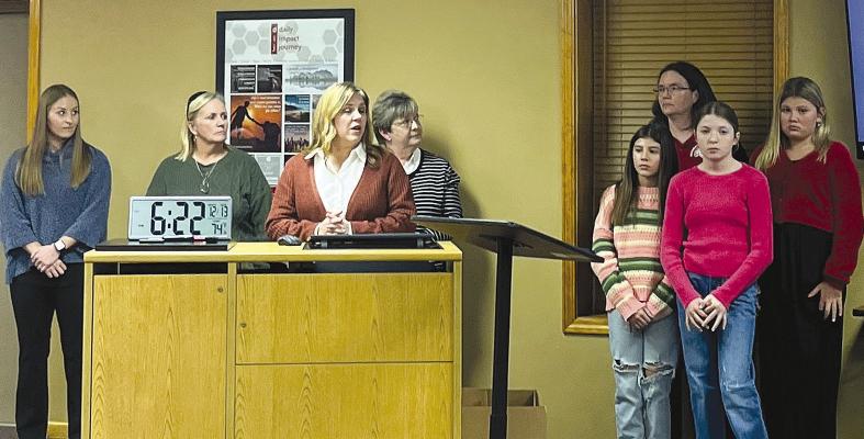 MALLORY COLE (from left), Staci Maddux, Brenda Hamm, Candice Schroeder, Harper Hockemeier, Emerson Mueller, Shari Donalson and Sophia Dorton present their Richmond Middle School highlights. SOPHIA BALES | Staff
