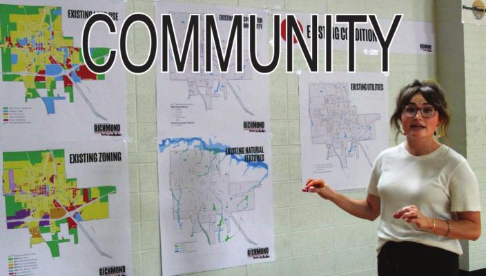 DURING THE CHARRETTE, Olsson Studio project planner Taylor Plummer discusses maps used to see where the city is and assist in where it might go. J.C. VENTIMIGLIA | Staff