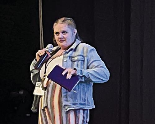 HOPE GRAY READS her poem which addresses her experience with suicide and how she found the light through God. SOPHIA BALES | Staff