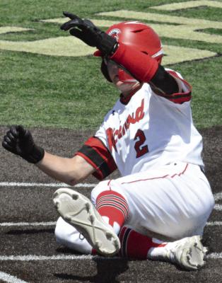 LOCHLAN STEELE slides into home plate during Richmond’s district-opening rout of Kansas City Central. Richmond then lost to Excelsior Springs in the district semifinals. SHAWN RONEY | Staff
