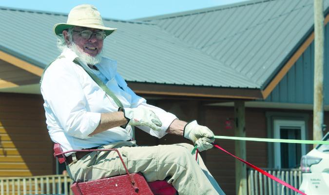 JEFF MCFADDEN leads his donkeys while passing environmental knowledge on to the next generation. MIRANDA JAMISON | Staff