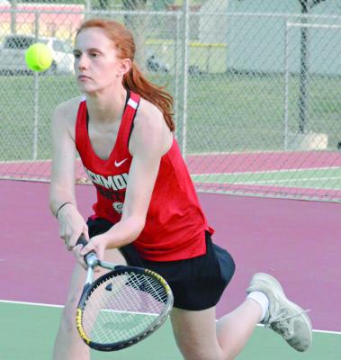TALYN TEEGARDEN hustles to attempt to return a shot during her singles match with Lexington’s Emma McMillan Tuesday at Maurice Roberts Park. SHAWN RONEY | Staff