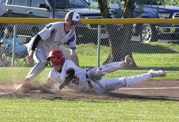 CONNER RODENDBERG hits the dirt in legging out a triple for the Spartans Monday during Richmond’s 7-0 win over West Platte at Southview Park. His extra-base hit sparks a four-run sixth inning. SHAWN RONEY | Staff