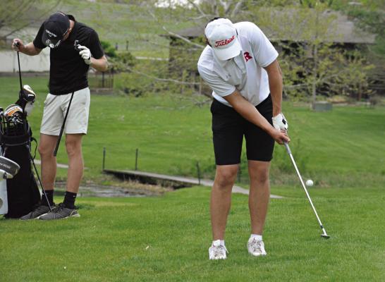 RICHMOND SENIOR Thomas Murphy attempts a chip shot late in his round April 28 at the Richmond Invitational at Shirkey Golf Course. SHAWN RONEY | Staff