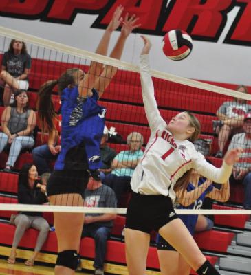 KELLY JAGGARS puts up a fight at the net for Richmond during the Spartans’ season and home opener Sept. 3 against Summit Christian Academy. SHAWN RONEY | Staff