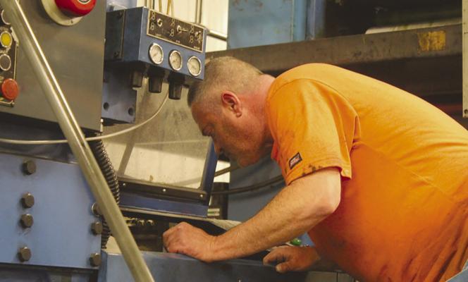 LEAD PRESSMAN Danny Schull works on the newspaper press, handling responsibilities ranging from printing publications to troubleshooting equipment and completing maintenance as part of the newspaper’s weekly production. SHARON DONAT | Staff