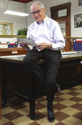 RAY COUNTY Presiding Commissioner Bob King looks over the title to the vehicle Sheriff Scott Childers is transferring for use to Ray County Emergency Management. J.C. VENTIMIGLIA | Staff