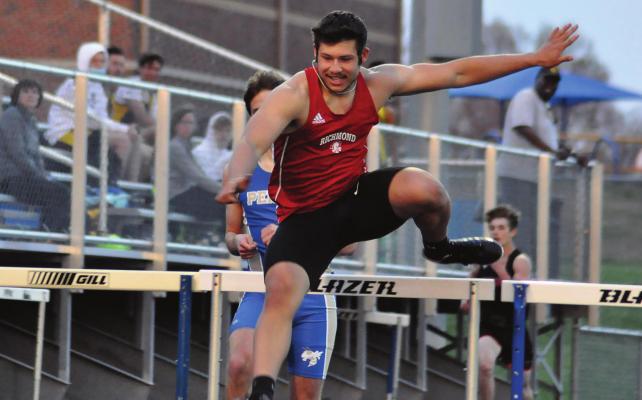 RICHMOND SENOR Matthew Lopez clears another hurdle as he races to victory Tuesday at the Hoefer-Husker Invitational in Higginsville. SHAWN RONEY | Staff