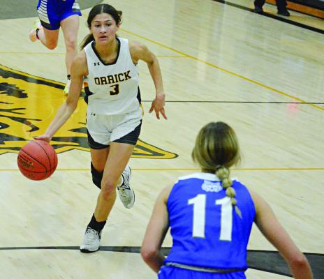 JUNIOR ANELA FLETCHER pushes the pace for Orrick as Southwest of Livingston County junior Leanna Smith awaits her during the first half of varsity girls basketball action Nov. 30 in the Orrick High School gym. SHAWN RONEY | Staff