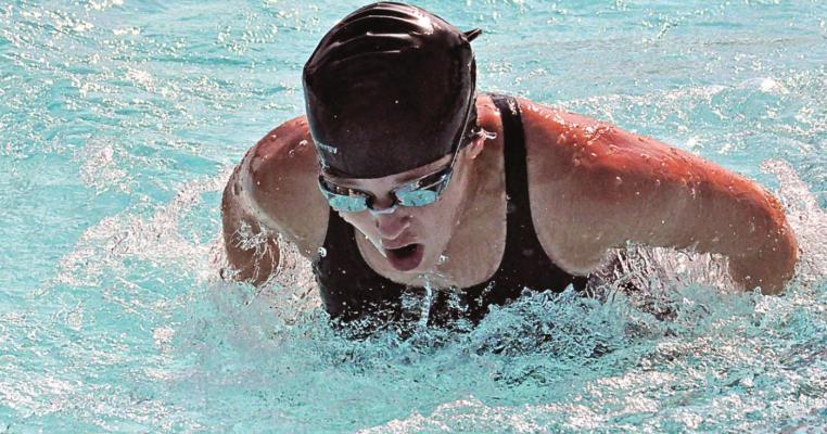 COVERING SWIMMING meets can spark one’s competitive fire. SHAWN RONEY | Staff