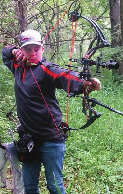 EXCELSIOR SPRINGS Middle School student Dantin McBee, 12, stands ready to hit his target.