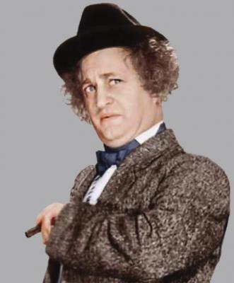 COMEDIAN Larry Fine of The Three Stooges played a cigar box instrument.
