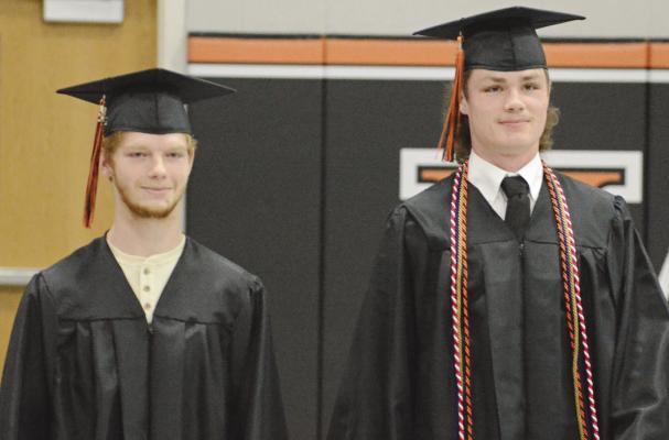 LEELIN AHRENS (left) and Kaleb Gant enter the Hardin-Central gym as the school band plays. SHAWN RONEY | Staff