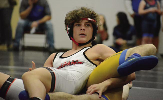 RICKY RUSS keeps his head up and the rest of his body down while maintaining control of Lafayette County’s William Ratliff during Richmond’s Jan. 25 home triangular with Lafayette County and Polo. SHAWN RONEY | Staff