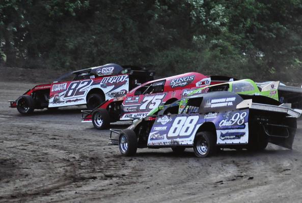 DRIVING THE NO. 82 car, Richmond’s David Wood makes sliding through a tight turn at Central Missouri Speedway near Warrensburg look way cool, as do a few stockcars behind him. SHAWN RONEY | Staff