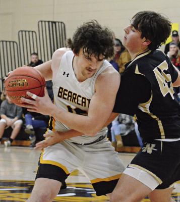 ORRICK SENIOR JAXON MILLER shields the ball from Thad Hopkins, a firstyear high schooler at Norborne, during varsity boys basketball action Jan. 5 at Orrick. SHAWN RONEY | Staff