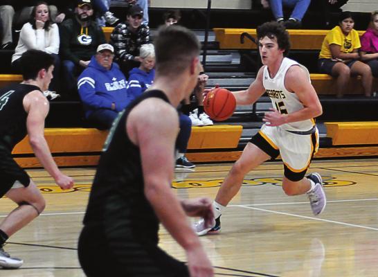 ORRICK SOPHOMORE Jaxon Miller drives against Crest Ridge’s defense during the second-quarter of the Bearcats’ 32-point loss Dec. 4 at Orrick to open the I-70 Conference Tournament. SHAWN RONEY | Staff
