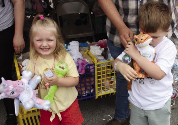 Miya (left) and Colton McMillan spend time making stuffed animals at the 42nd Annual Mushroom Festival last weekend. SOPHIA BALES | Staff