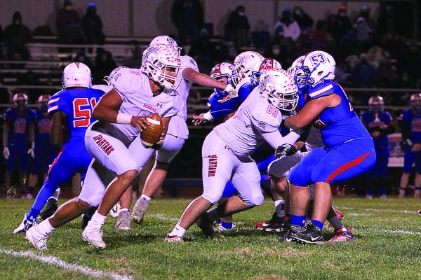 AFTER THE SPARTANS fail to win any games in 2018, junior quarterback Keyshaun Elliott comes ready to play Lexington. He rushes for three touchdowns and throws for a fourth in the 32-16 win that gives Richmond The Bell and the Missouri River Valley East Conference championship.