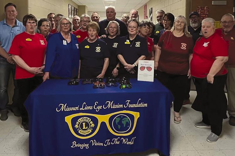 MEMBERS OF THE Lions Club from Orrick, Maryville, St. Louis and Independence gather to commemorate the conclusion of a successful eye clinic that served 75 members of the community. Submitted