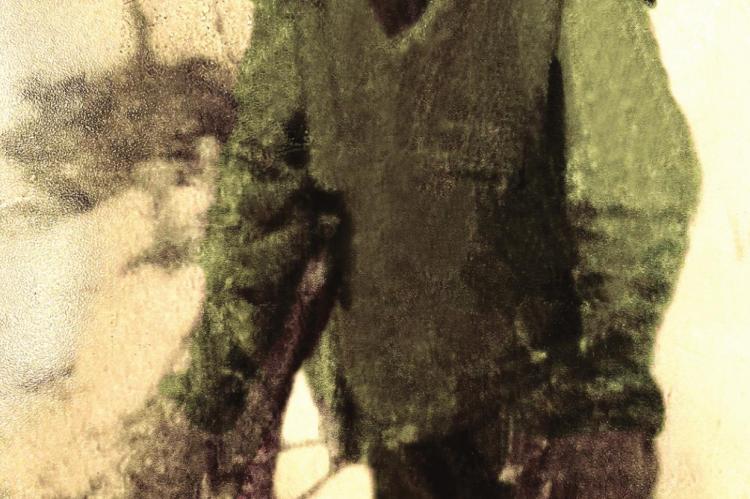 A FADED photograph, retouched, shows Ira Anderson while serving 70 years ago during the Korean War.
