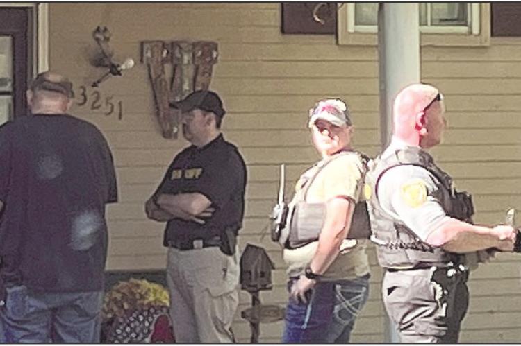 Ray County Sheriff’s Department Deputy Ray Orth (from left), Criminal James Woodruff Sr., Sheriff Scott Childers, Mental Health Deputy Mason Lumpkins, Detective Celeste Kaiser, Deputy Shannon Case and Lieutenant Amy Sisson responded to a call regarding Woodruff. SOPHIA BALES | Staff