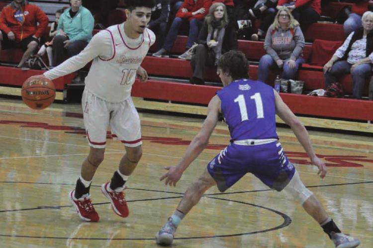 SENIOR DIONTE MARQUEZ, seen here dribbling during a late January game at Richmond High School, has been named a Class 3 all-state basketball selection.